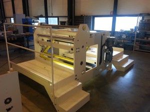 Axial unwinder with dancing roll tension control